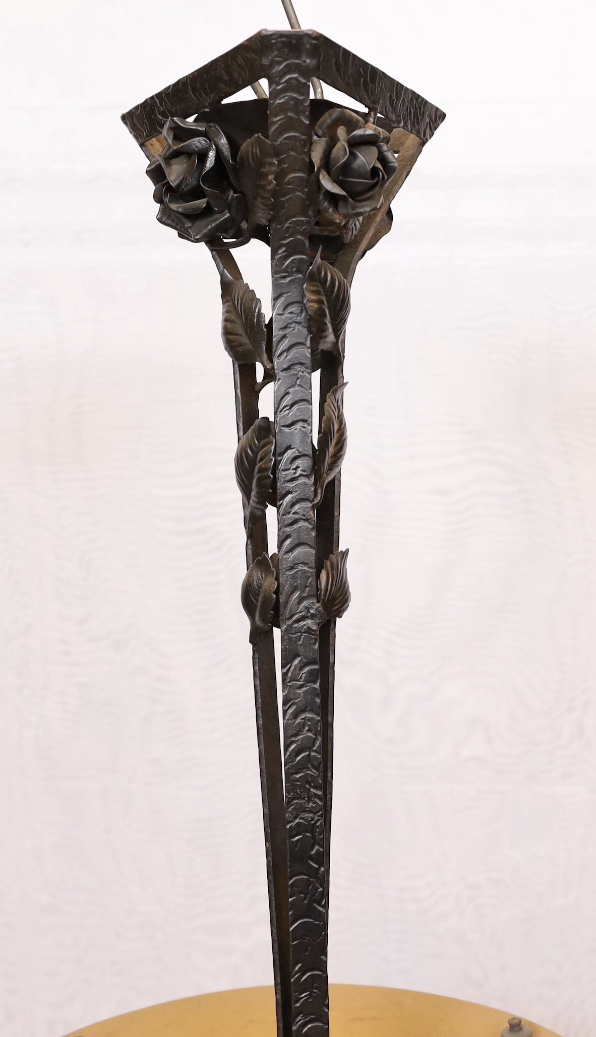 A 1920s–30s French wrought iron and marbled glass light fitting with rose motifs, drop 70cm. width 40cm